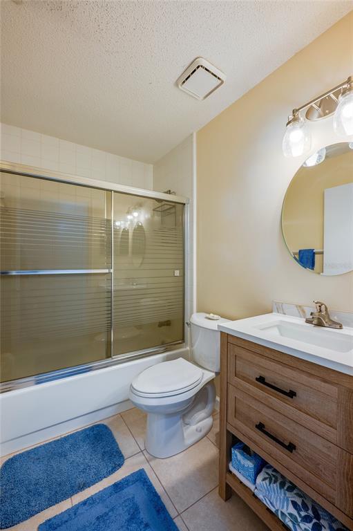 128 Crooked Pine Road Port Orange, FL 32128 - Photo 24 of 46 a bathroom with a sink a toilet a mirror and shower