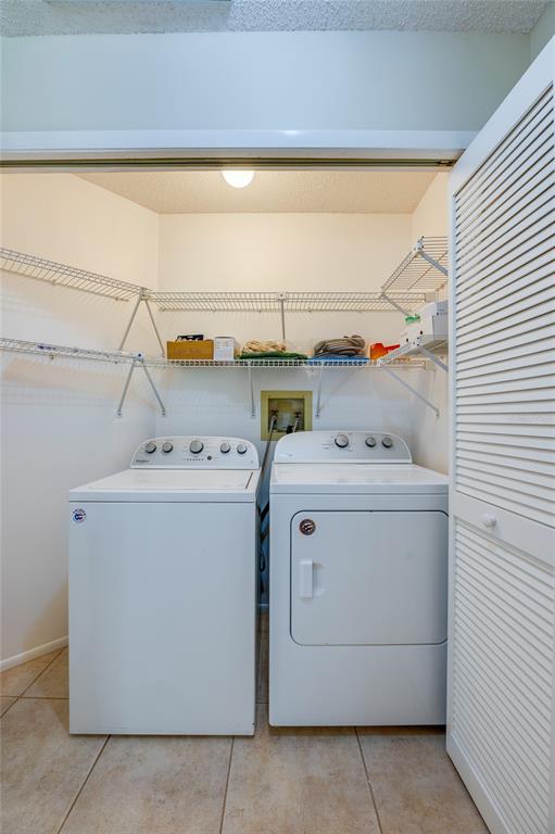 128 Crooked Pine Road Port Orange, FL 32128 - Photo 27 of 46 a utility room with dryer and washer
