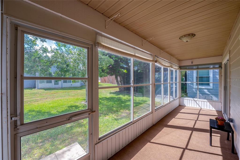 128 Crooked Pine Road Port Orange, FL 32128 - Photo 28 of 46 a view of a porch with wooden floor and outdoor space