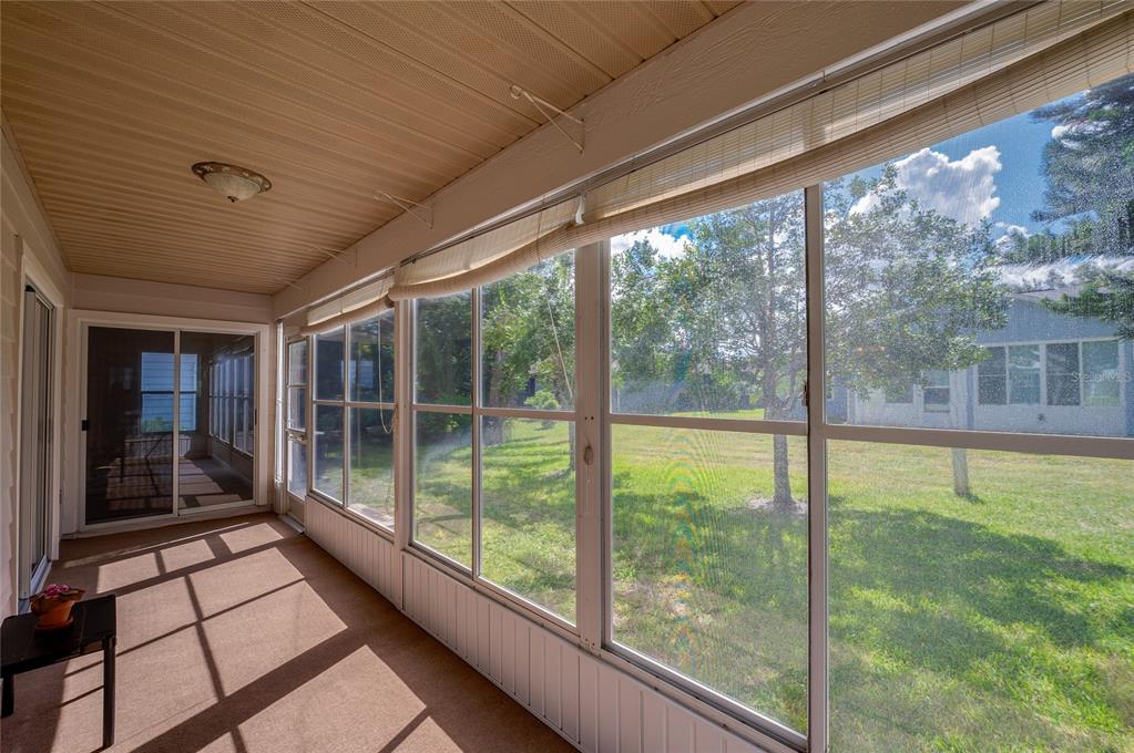 128 Crooked Pine Road Port Orange, FL 32128 - Photo 29 of 46 a view of a porch with wooden floor and outdoor space