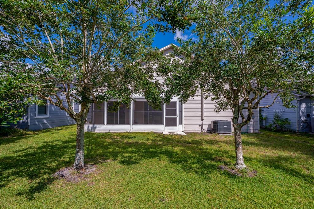 128 Crooked Pine Road Port Orange, FL 32128 - Photo 31 of 46 a house view with a sitting space and garden