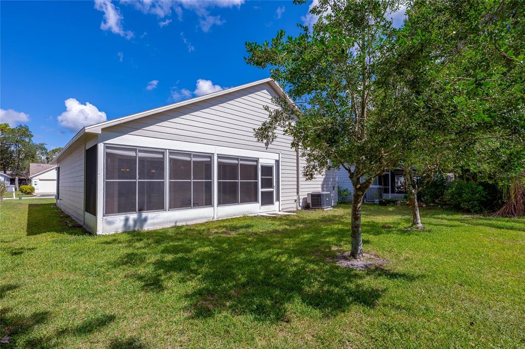 128 Crooked Pine Road Port Orange, FL 32128 - Photo 32 of 46 a view of a house with a yard and tree s