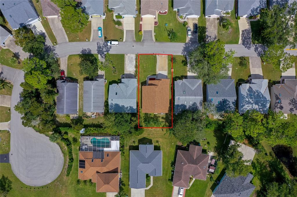 128 Crooked Pine Road Port Orange, FL 32128 - Photo 35 of 46 an aerial view of a house with garden space and a street view