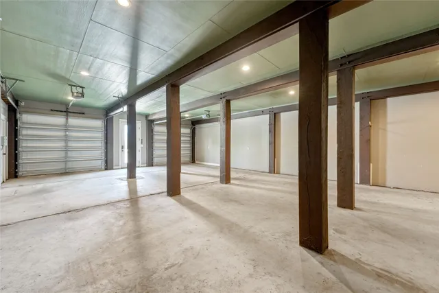 an aerial view of a houses with a lake view