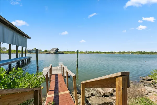 a view of a lake with sitting area
