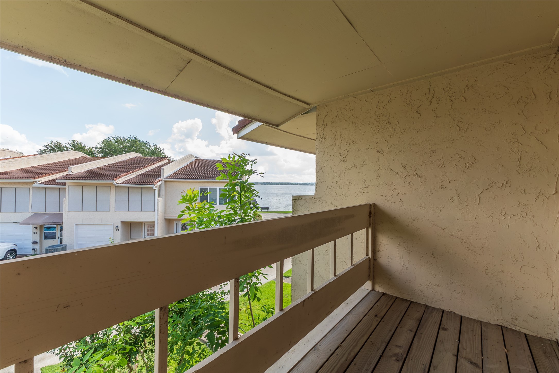 38 Regency Point Montgomery, TX 77356 - Photo 22 of 49 balcony outside the primary bedroom looking to the right. Lake is seen beyond