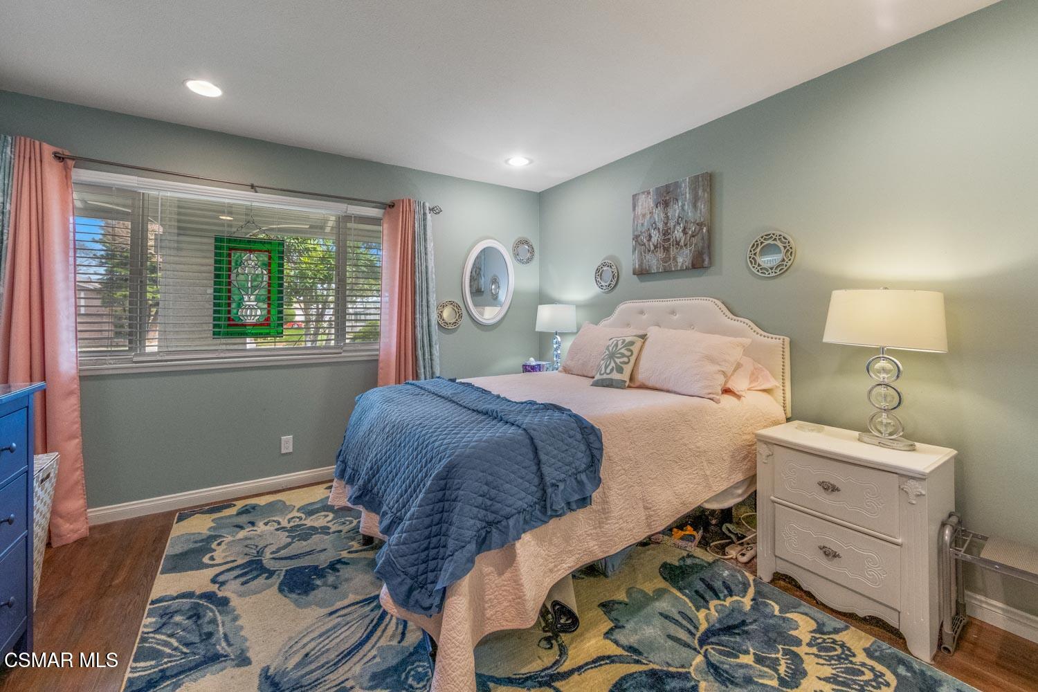 2413 Lita Place Simi Valley, CA 93063 - Photo 12 of 17 a bedroom with a bed and a window