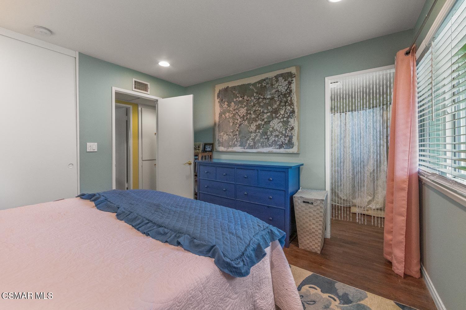 2413 Lita Place Simi Valley, CA 93063 - Photo 13 of 17 a bedroom with a bed and a mirror