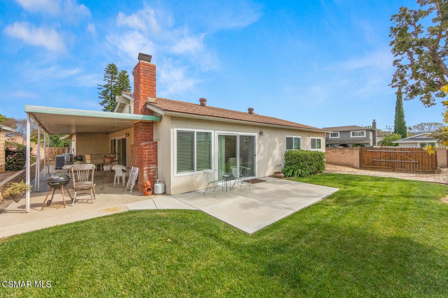 2413 Lita Place Simi Valley, CA 93063 - Photo 16 of 17 a front view of a house with patio and garden