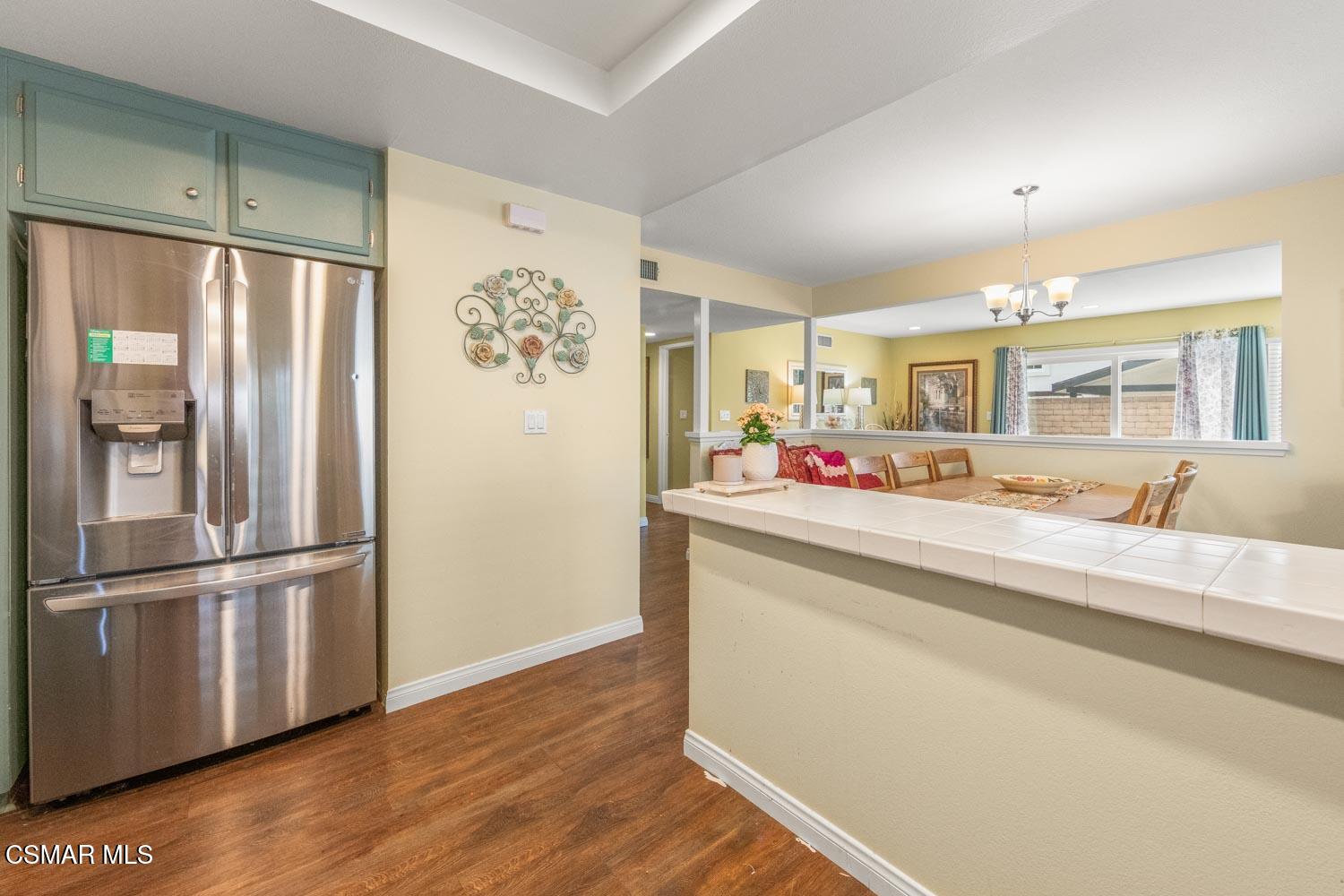 2413 Lita Place Simi Valley, CA 93063 - Photo 6 of 17 a kitchen with stainless steel appliances granite countertop a refrigerator and a sink