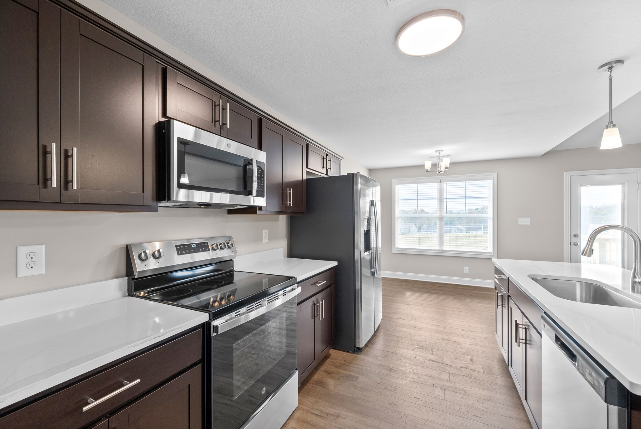 30 Echo Ridge Oak Grove, KY 42262 - Photo 13 of 43 a kitchen that has a sink and a stove top oven