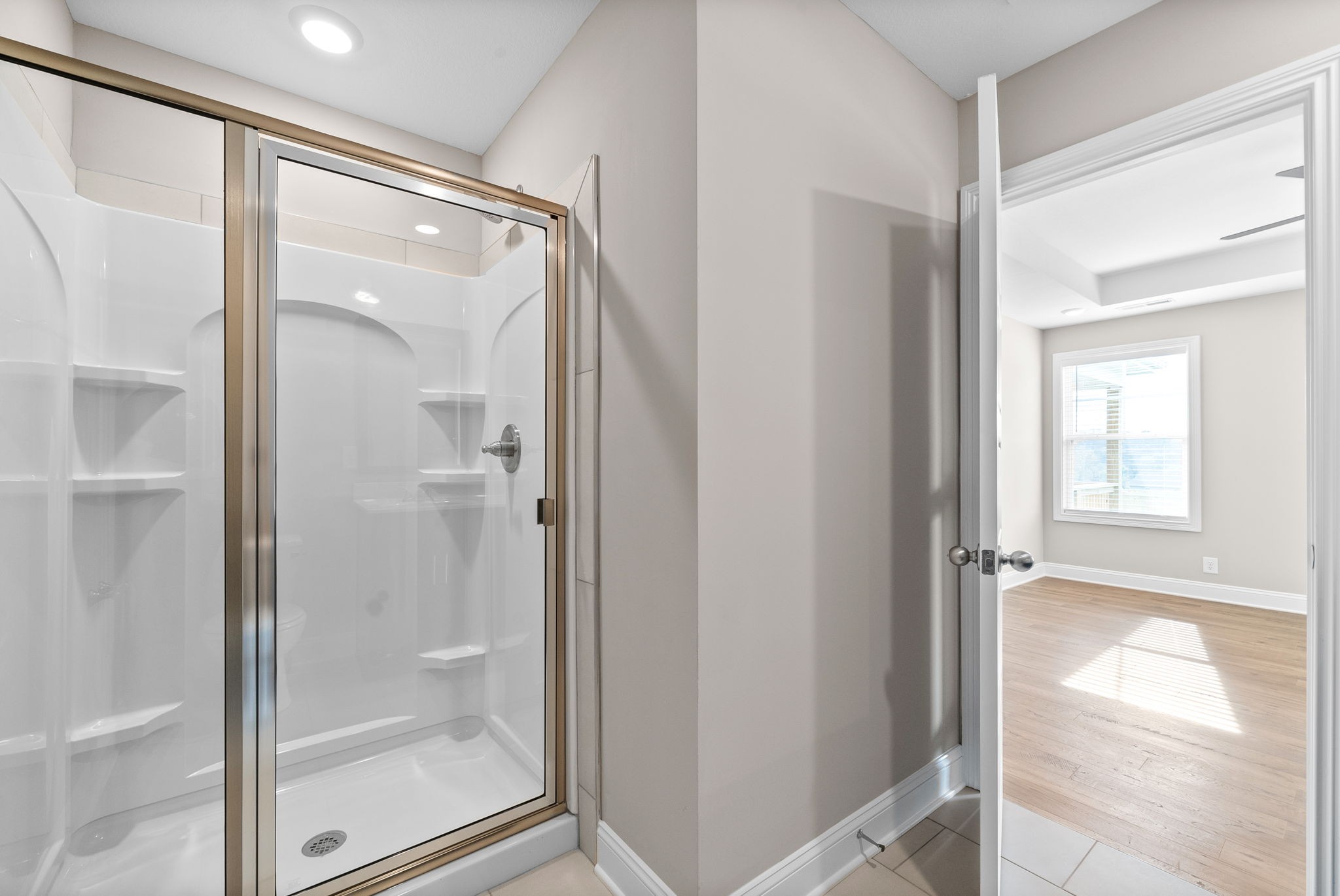 30 Echo Ridge Oak Grove, KY 42262 - Photo 23 of 43 a bathroom with a glass shower door and mirror