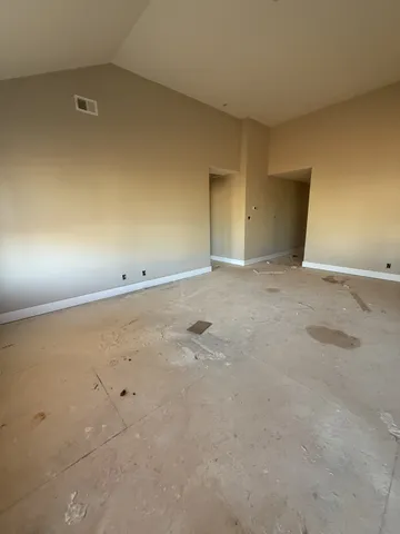 an empty room with an natural light