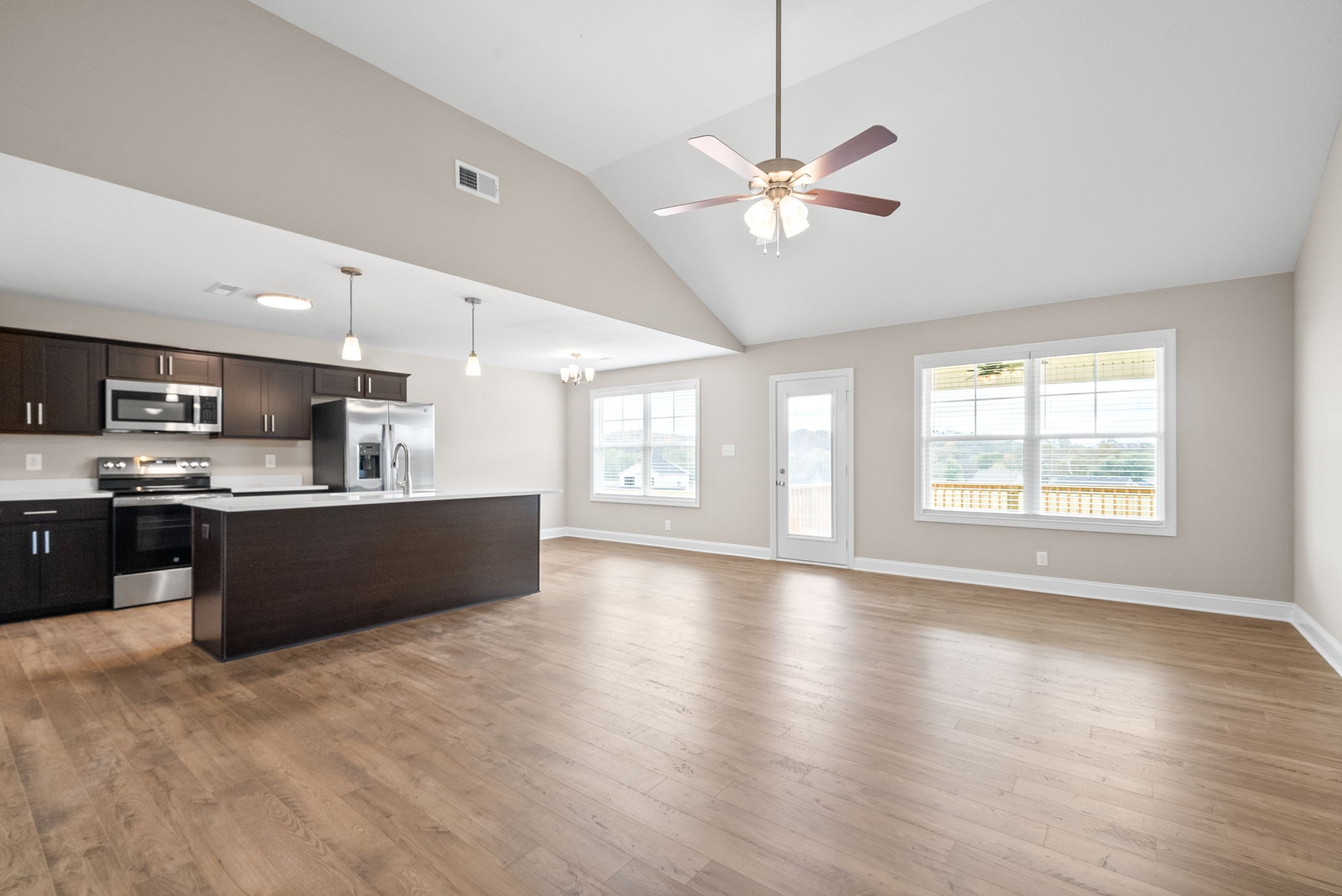 30 Echo Ridge Oak Grove, KY 42262 - Photo 7 of 43 a large kitchen with stainless steel appliances kitchen island a large counter top and wooden floors