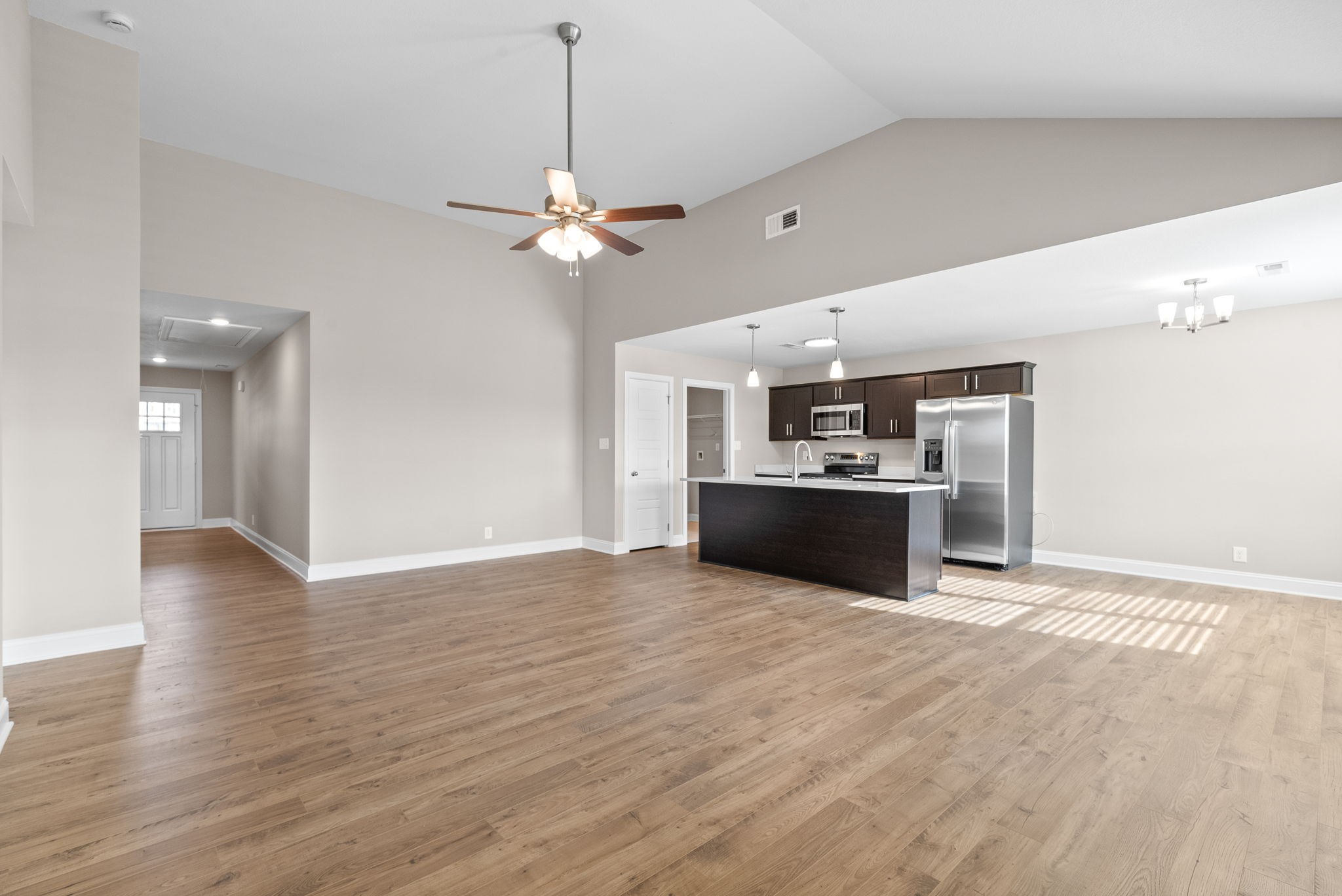 30 Echo Ridge Oak Grove, KY 42262 - Photo 8 of 43 a view of a kitchen with a sink hardwood floor and a ceiling fan