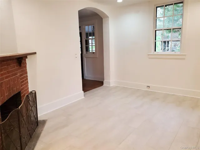 a front view of a building with a garden