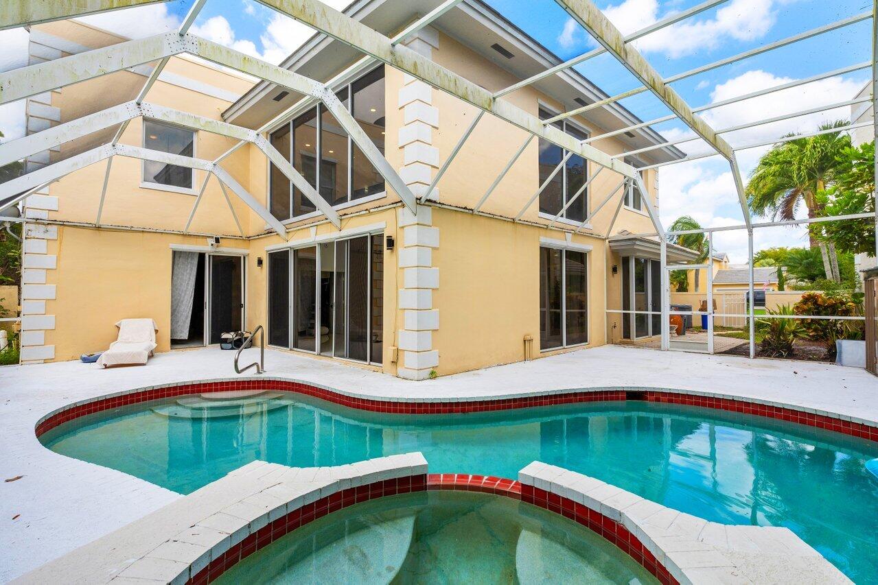 7748 Travelers Tree Drive Boca Raton, FL 33433 - Photo 29 of 35 a house view with swimming pool