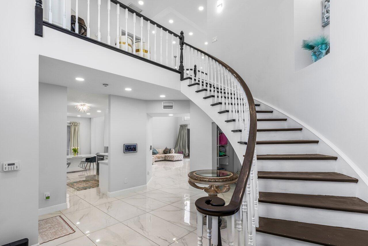 7748 Travelers Tree Drive Boca Raton, FL 33433 - Photo 4 of 35 a view of entryway and hall with wooden floor