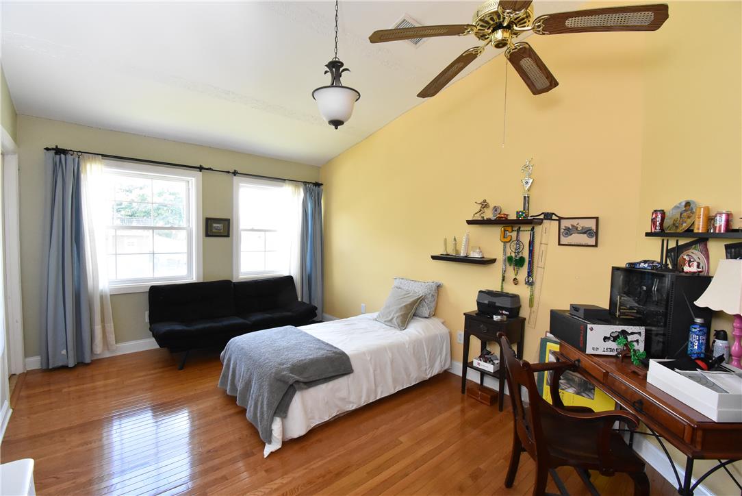 424 Grape Street Whitehall, PA 18052 - Photo 35 of 50 This spacious bedroom offers gleaming hardwood floors and ample natural light through its large windows.