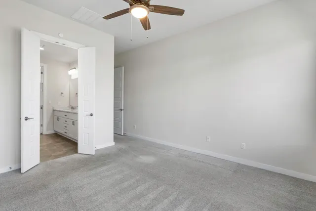 an empty room with a bathroom