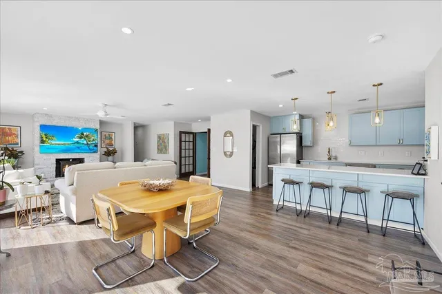 a large kitchen with a table and chairs in it