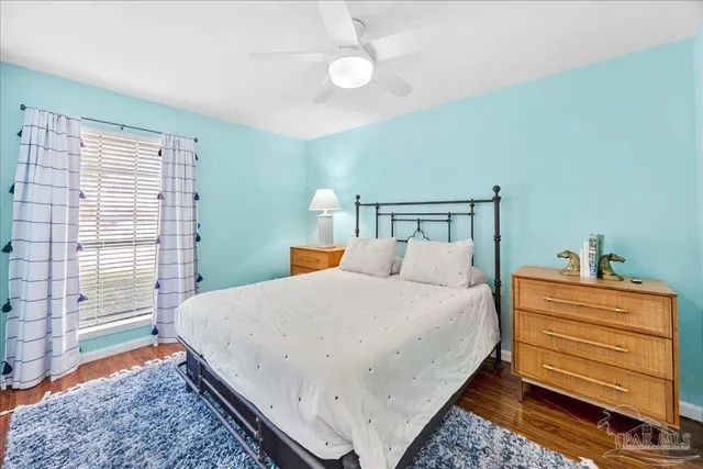 a bed room with a bed and a window