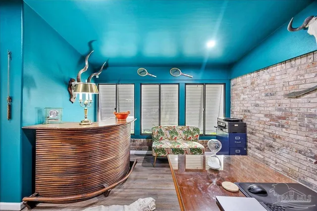 a view of living room filled with furniture and a fireplace