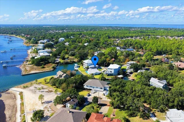 an aerial view of a houses with a yard