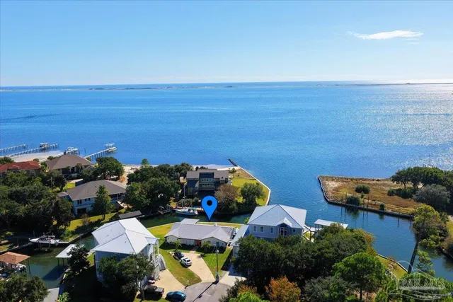 a aerial view of a house with table and chairs