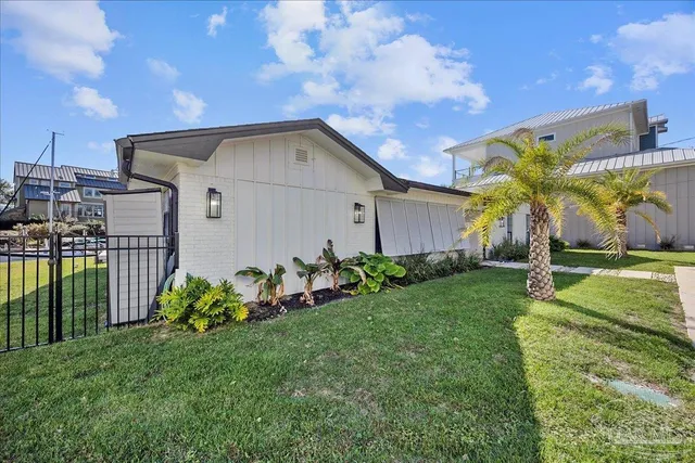 a house view with swimming pool and garden