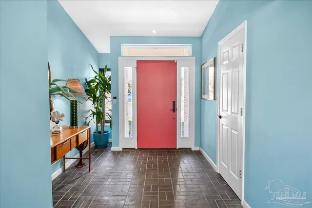 a hallway with sitting area and entryway