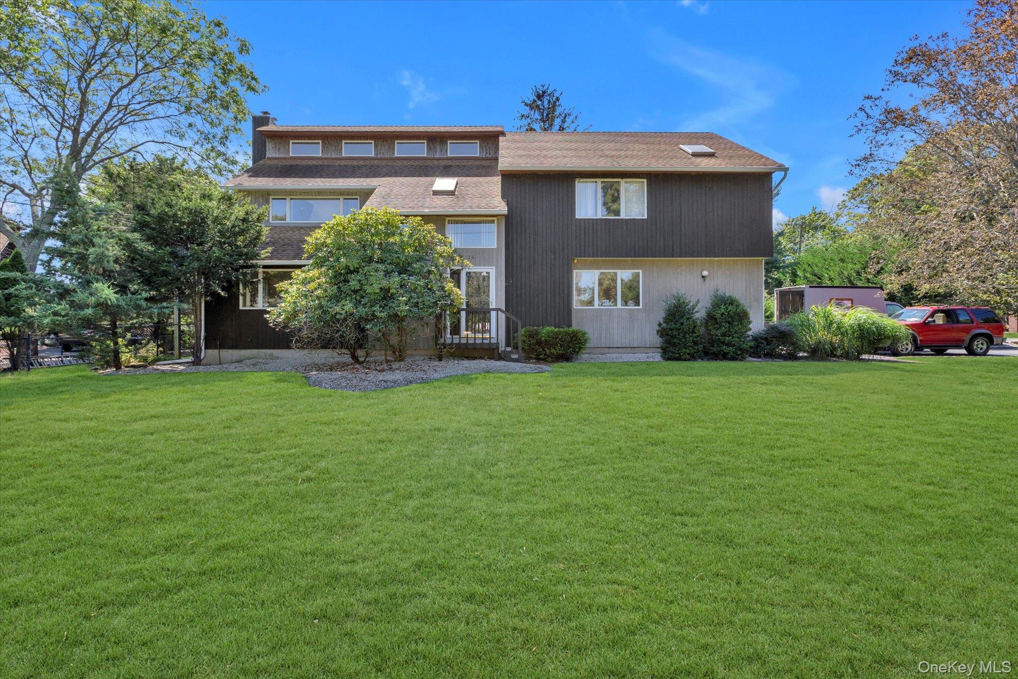 34 Sedgemere Road Center Moriches, NY 11934 - Photo 1 of 1 a view of a house with garden