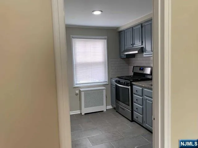 a kitchen with a stove and a microwave