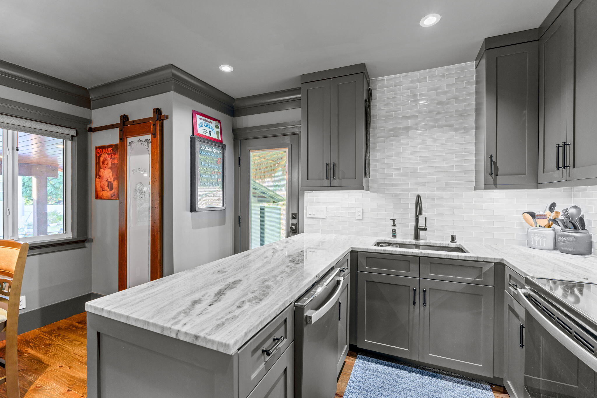 236 West 24th Street Riviera Beach, FL 33404 - Photo 12 of 48 a kitchen with stainless steel appliances granite countertop a sink stove and refrigerator