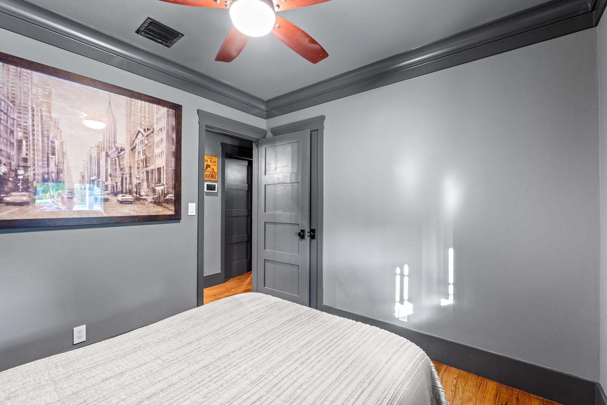 236 West 24th Street Riviera Beach, FL 33404 - Photo 19 of 48 a bedroom with a large bed and a chandelier