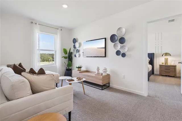 a living room with furniture and window
