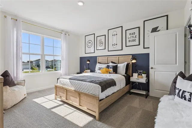 a bedroom with a large bed and a couch