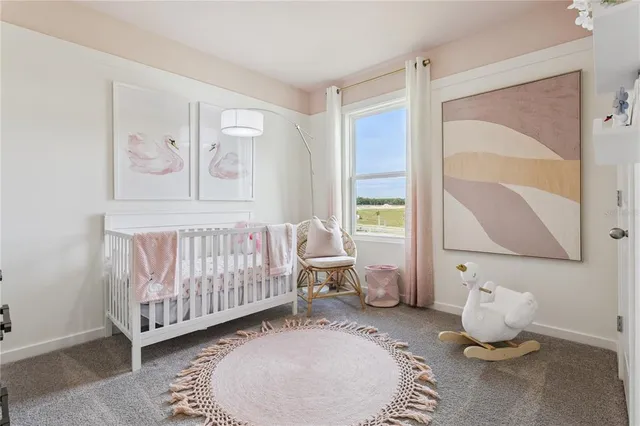 a bedroom with furniture and window