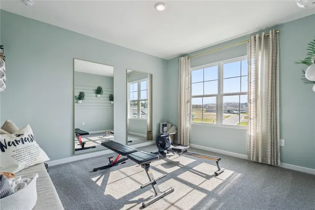 a living room with furniture and a window