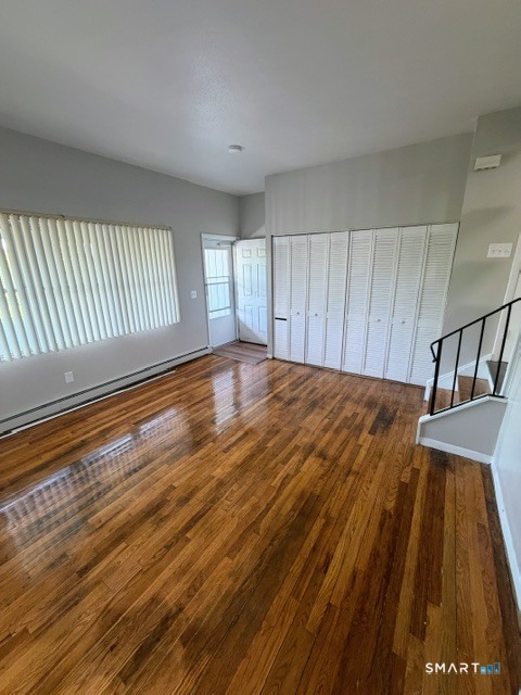 351 Mill Rock Road, Unit 351 Hamden, CT 06517 - Photo 3 of 13 a view of a room with wooden floor