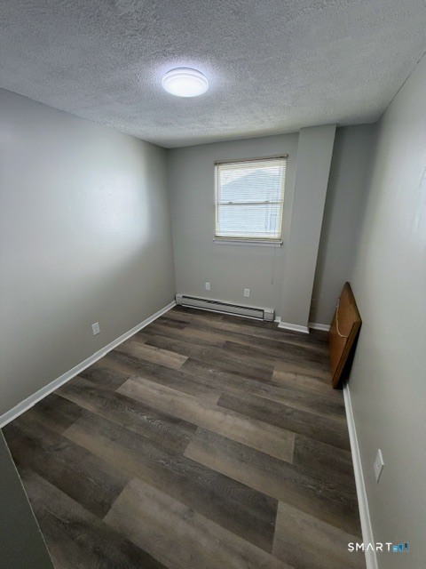 351 Mill Rock Road, Unit 351 Hamden, CT 06517 - Photo 8 of 13 a view of room with wooden floor and fan