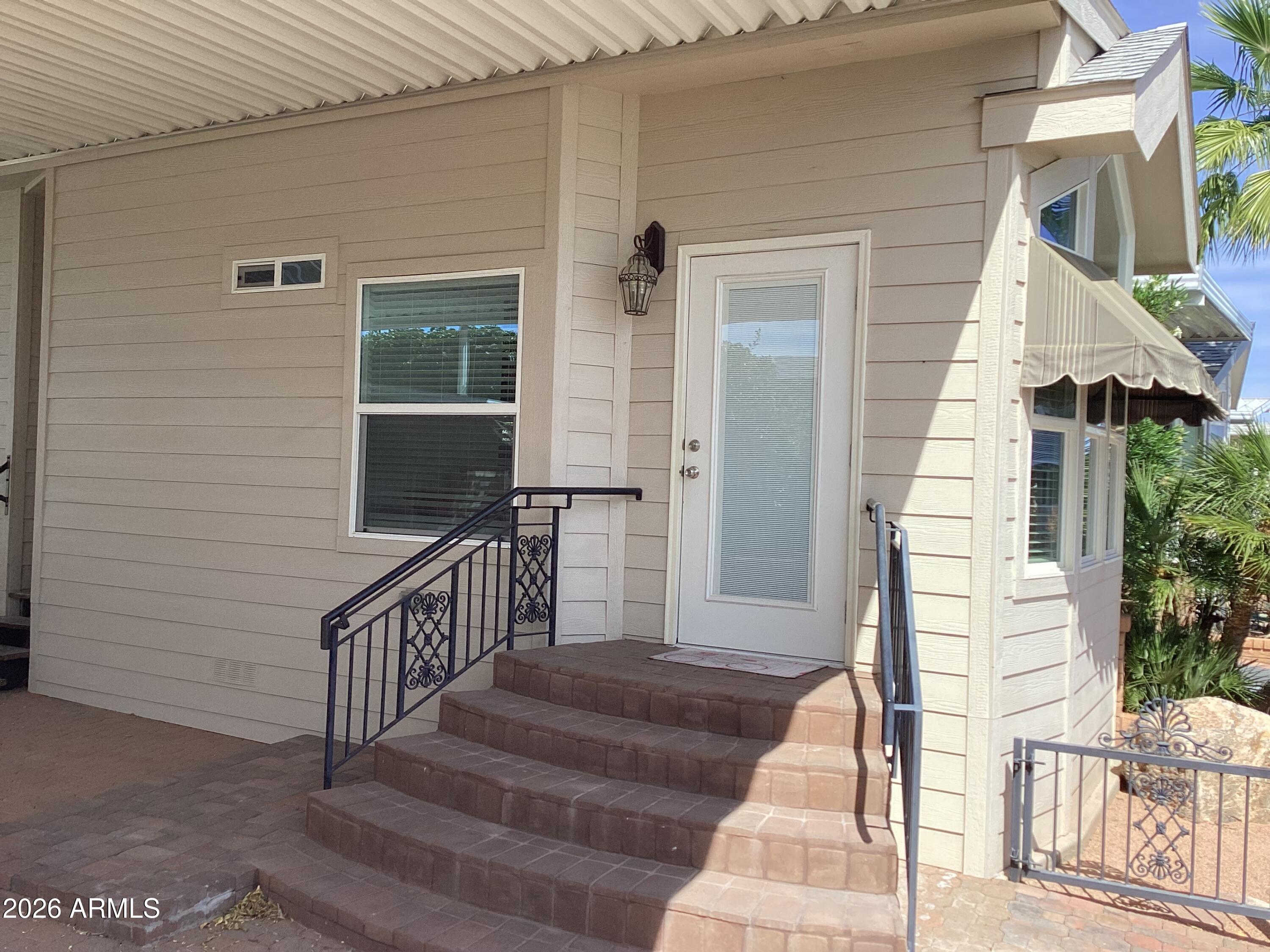 111 South Greenfield Road, Unit 163 Mesa, AZ 85206 - Photo 2 of 16 a view of entryway with wooden floor