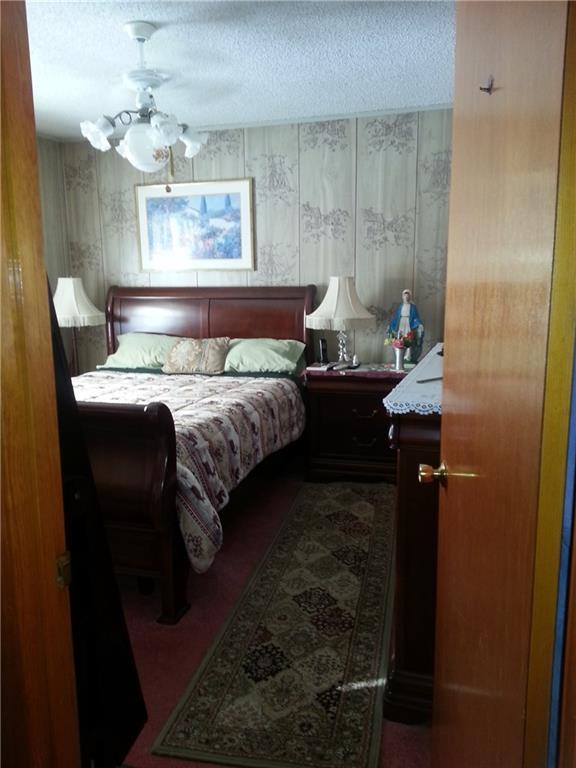 107 Dinsmore Road Sidney, ME 04330 - Photo 9 of 25 MASTER BEDROOM WITH NEWER RUG