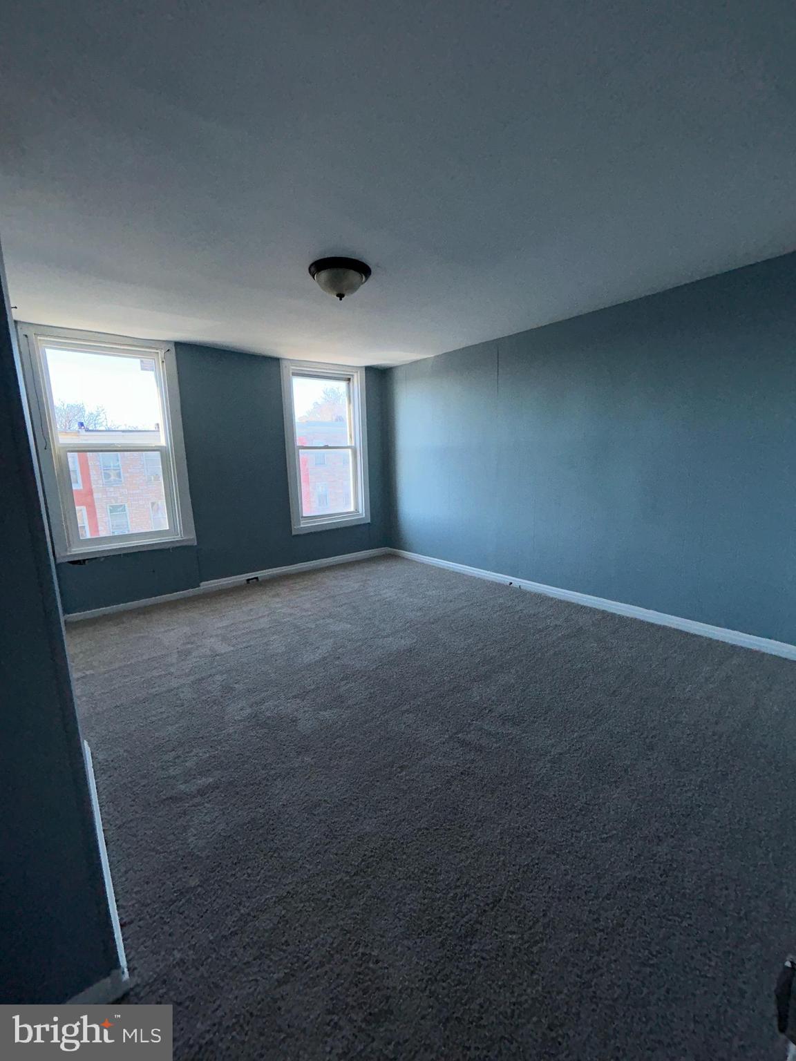 337 South Mount Street Baltimore, MD 21223 - Photo 12 of 16 an empty room with windows