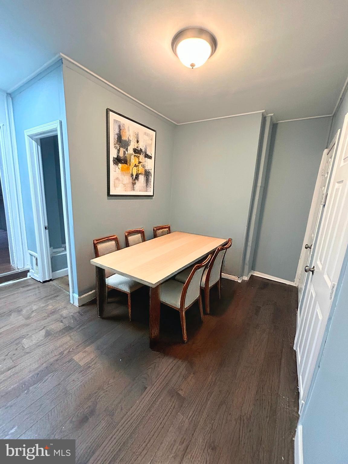 337 South Mount Street Baltimore, MD 21223 - Photo 6 of 16 a view of a dining room with furniture and wooden floor