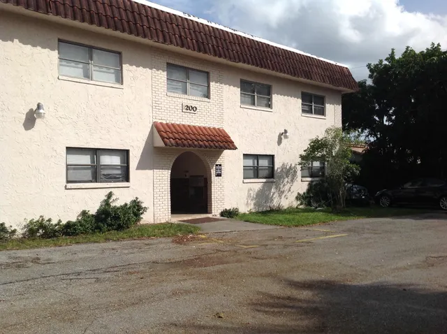 a view of a house with a yard and garage