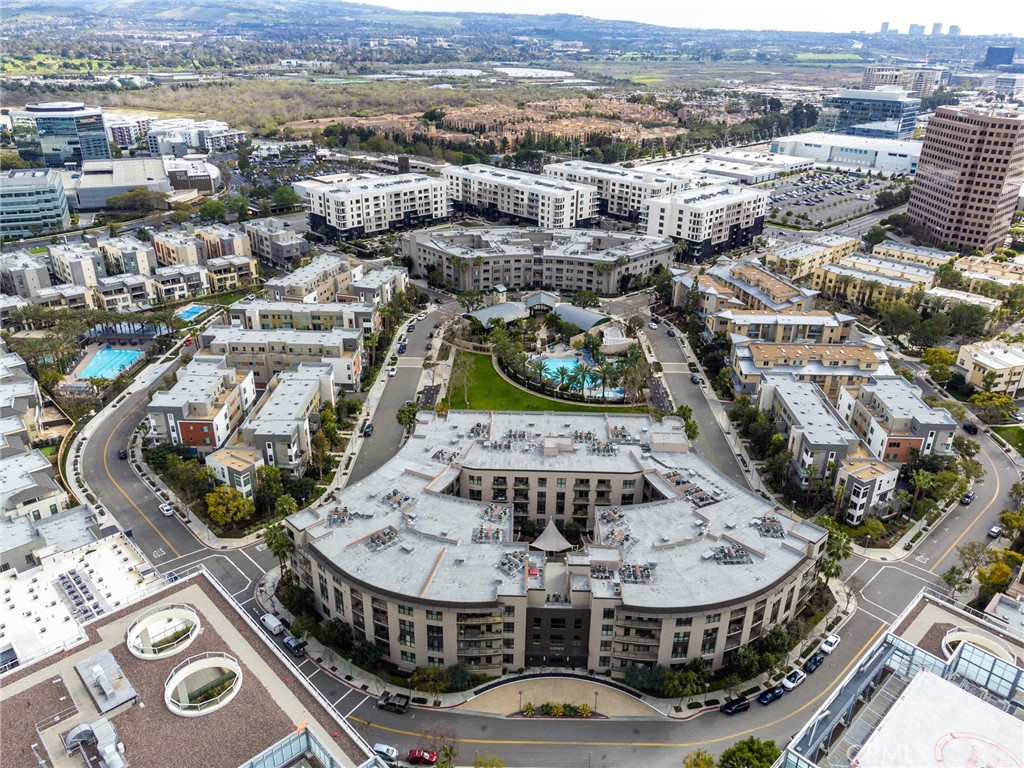 21 Gramercy, Unit 220 Irvine, CA 92612 - Photo 1 of 1 an aerial view of residential houses with outdoor space
