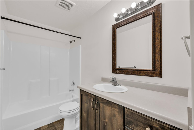 5875 Challenger Way St. George, UT 84790 - Photo 15 of 18 Bathroom vanity with a composite countertop and an integrated sink