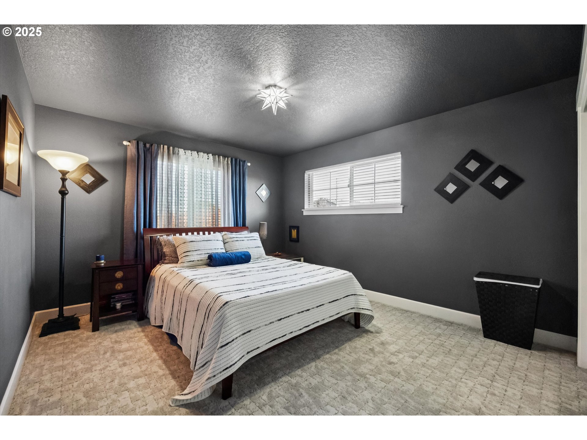 2440 Heather Way Forest Grove, OR 97116 - Photo 15 of 24 a bedroom with a bed and a lamp