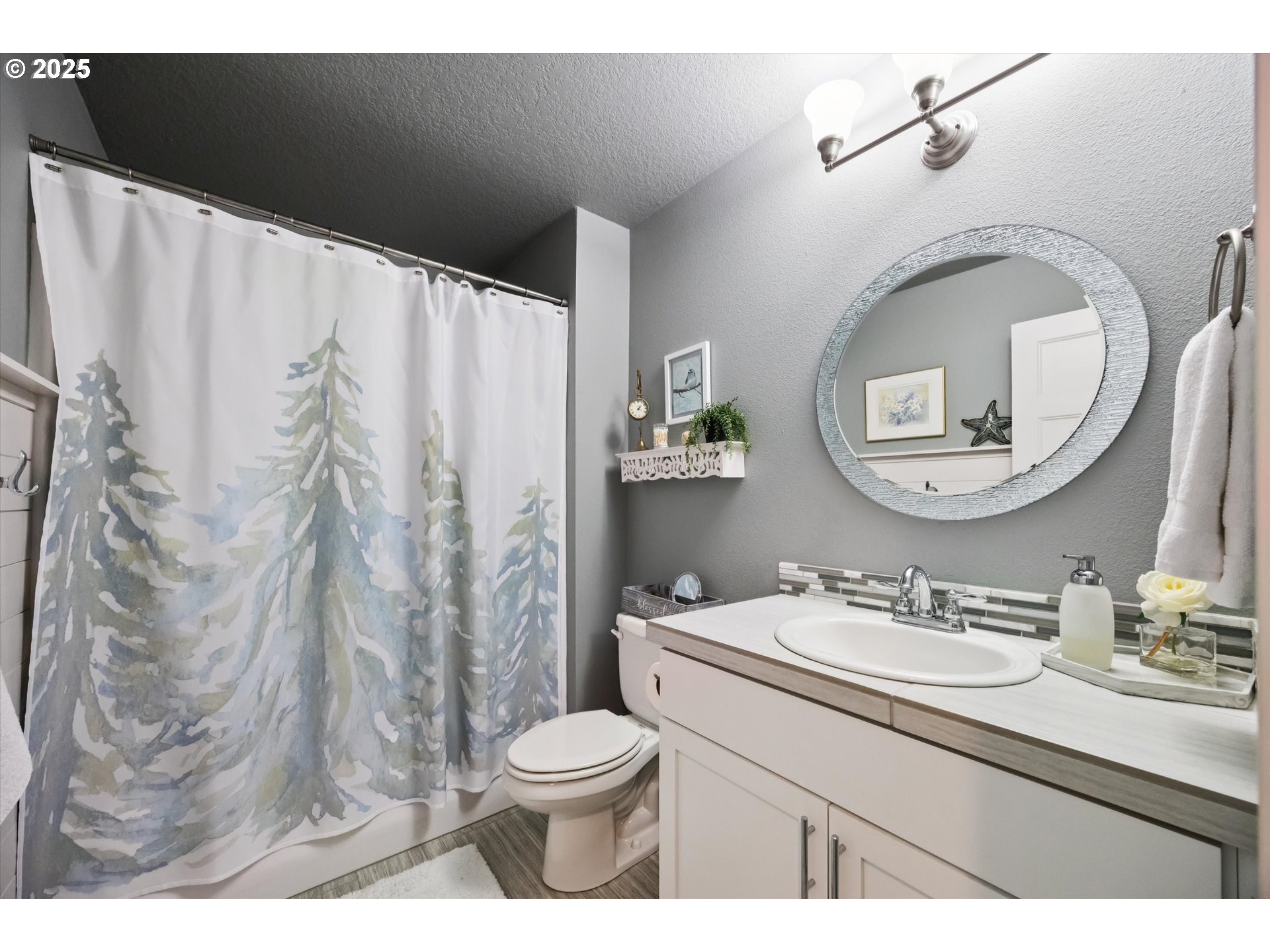 2440 Heather Way Forest Grove, OR 97116 - Photo 16 of 24 a bathroom with a sink a toilet and a mirror